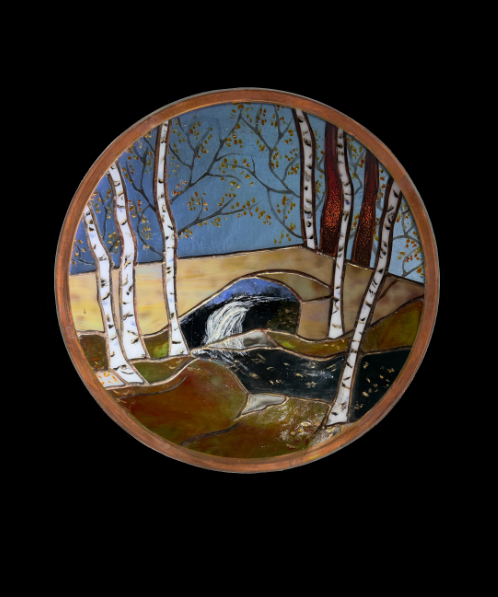 Crossing the stone bridge into the woods in Autumn